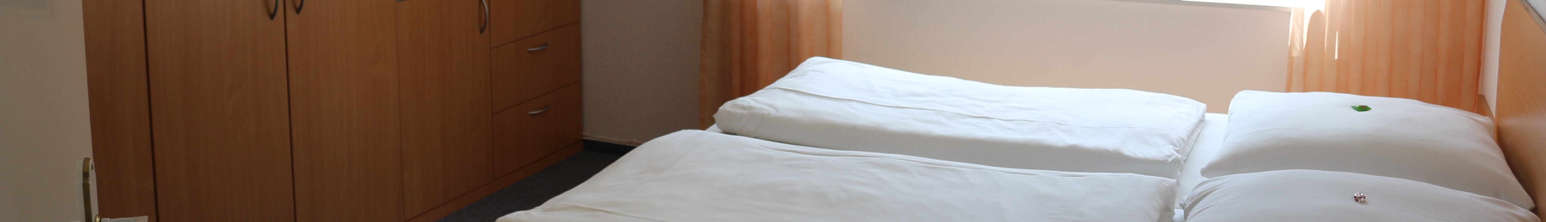 Banner mit Bild des Schlafzimmers Suite.